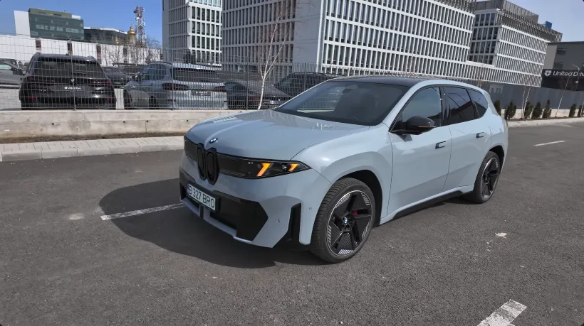 BMW iX3 50 xDrive side profile at sunset